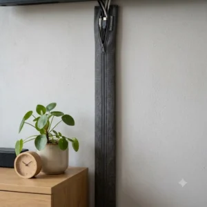 Flexible and modern TV cable cover made of fabric with a zipper for multiple cables.
